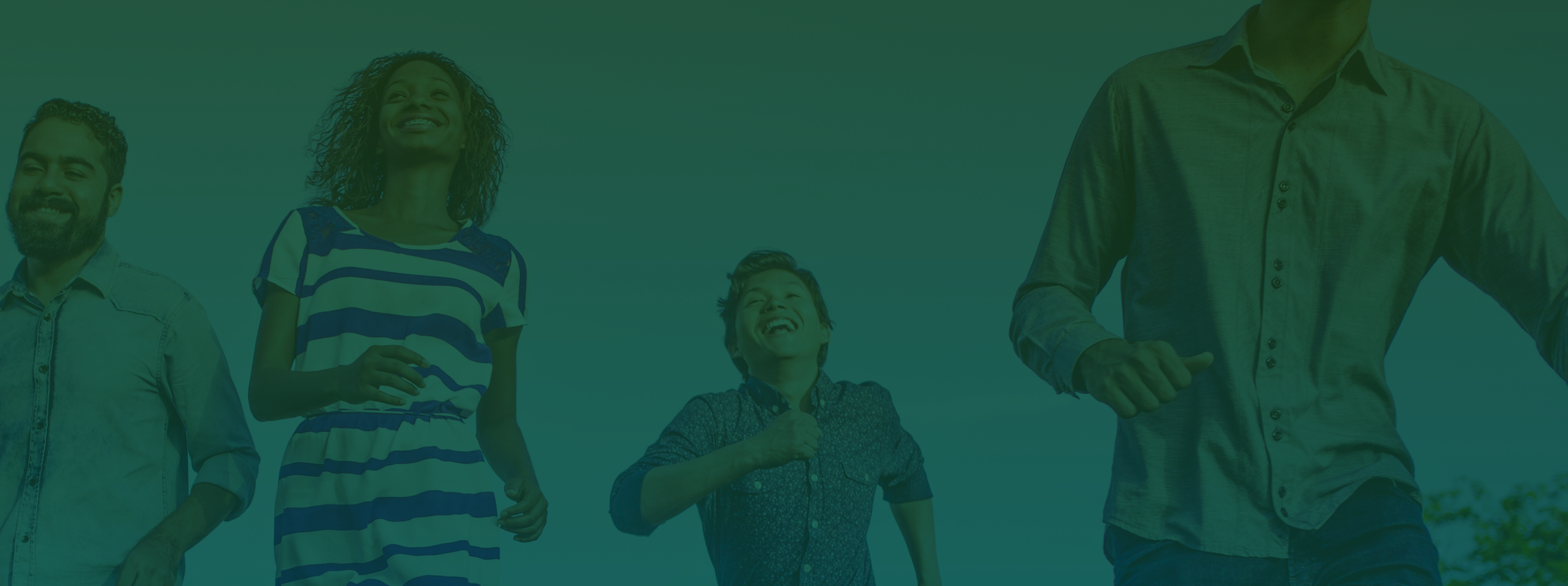 Green filtered image of 3 adults and a child running towards the camera